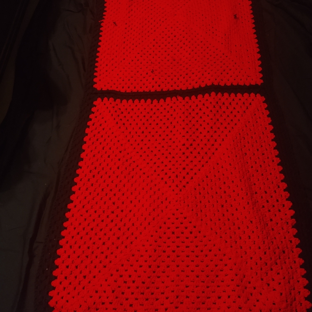 Back and red afghan throw
